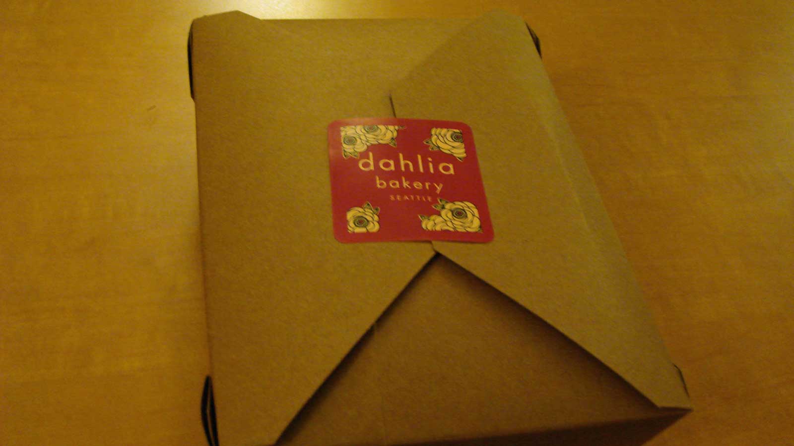 A box from Dahlia bakery with pie inside