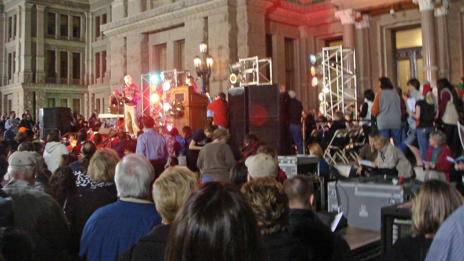 Crowds singing Christmas songs at the Texas State Capitol