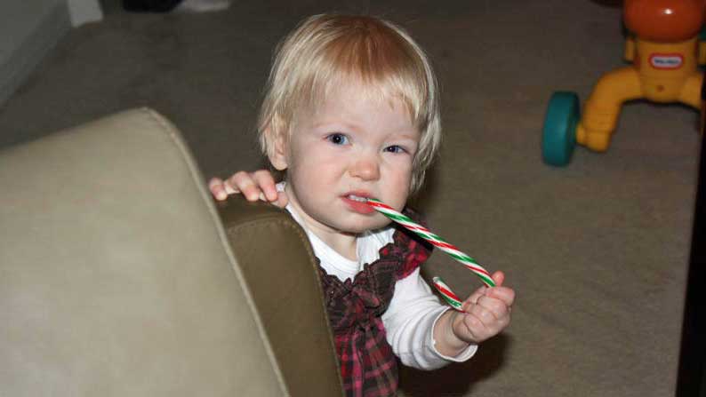Emily eating a candy cane